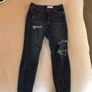Distressed denim jeans